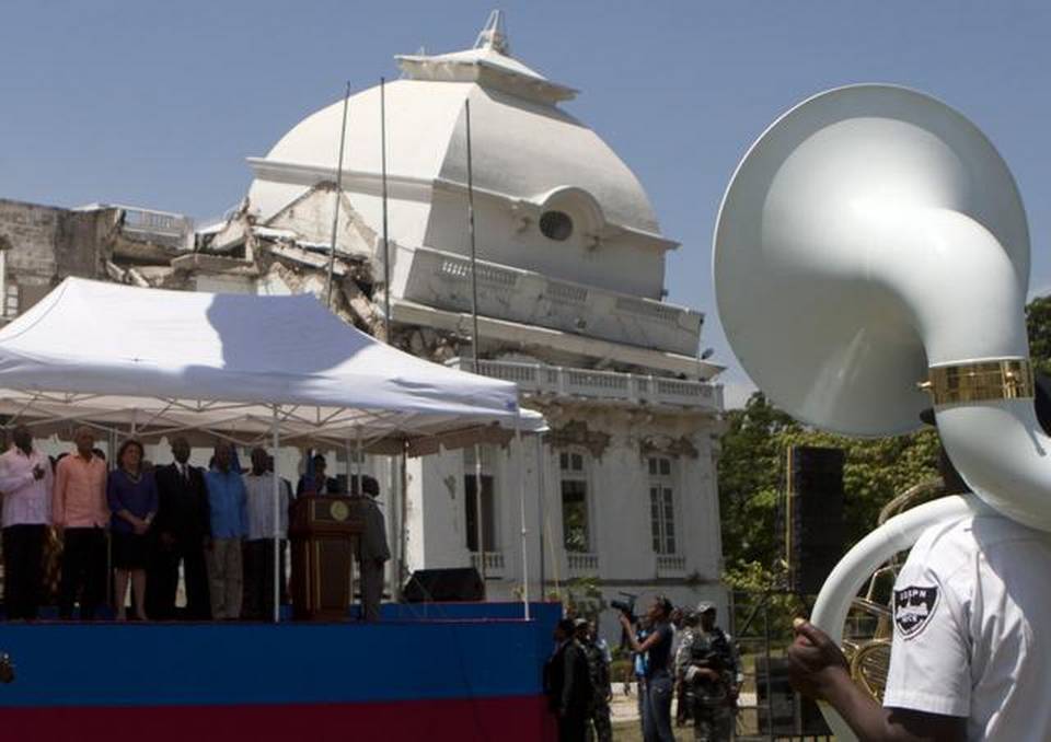 Haiti's President Michel Martelly, second from left, stands at attention on a platform as band members play the country's national anthem, before the start of Martelly's press conference, announcing the demolition of the earthquake damaged National Palace, in Port-au-Prince, Haiti. Dieu Nalio Chery AP Read more here: https://www.miamiherald.com/opinion/issues-ideas/article5765367.html#storylink=cpy